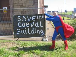 Superman saving the Coeval Building from falling down